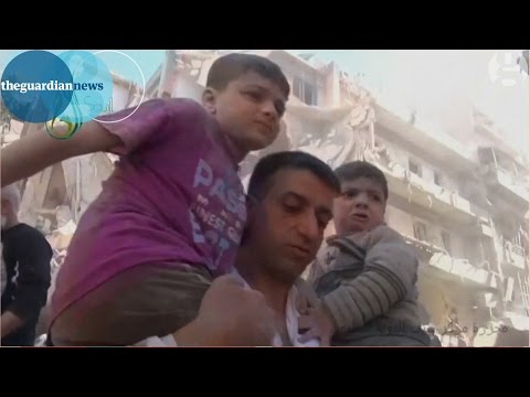 Syria war 2015: Aleppo schoolchildren pulled from rubble of bombed school