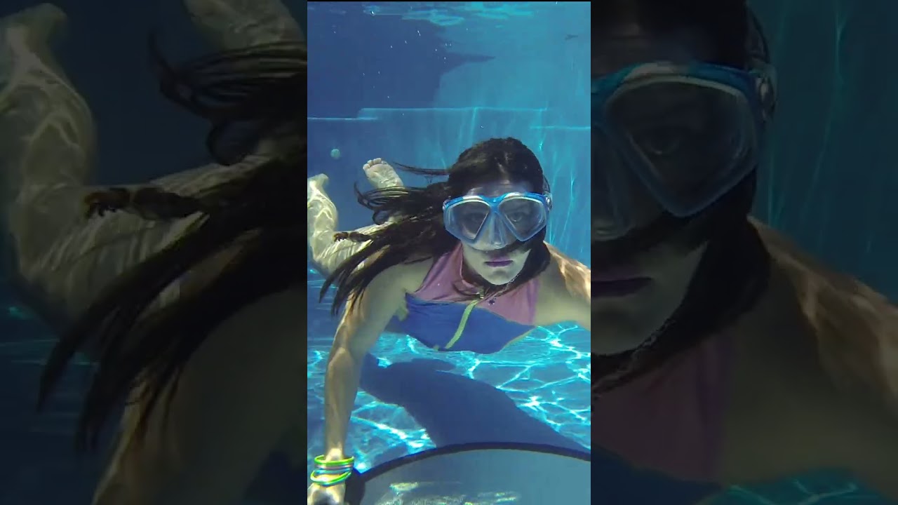 Beautiful in Blue Underwater Breath Holding in Scuba Mask Long Hair. 