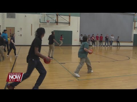 Students at Lima West Middle School playing dodgeball to help a student at Bath Elementary School