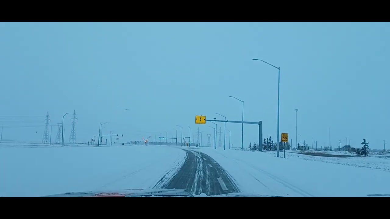 Snowing early in the morning in Winnipeg,  Manitoba Canada.  Highway 101 West.