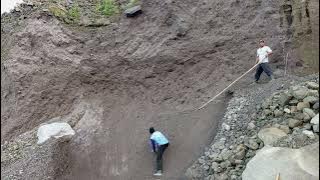 Lowering The Sand Using Long Bamboo Spears Begins Mining Activities