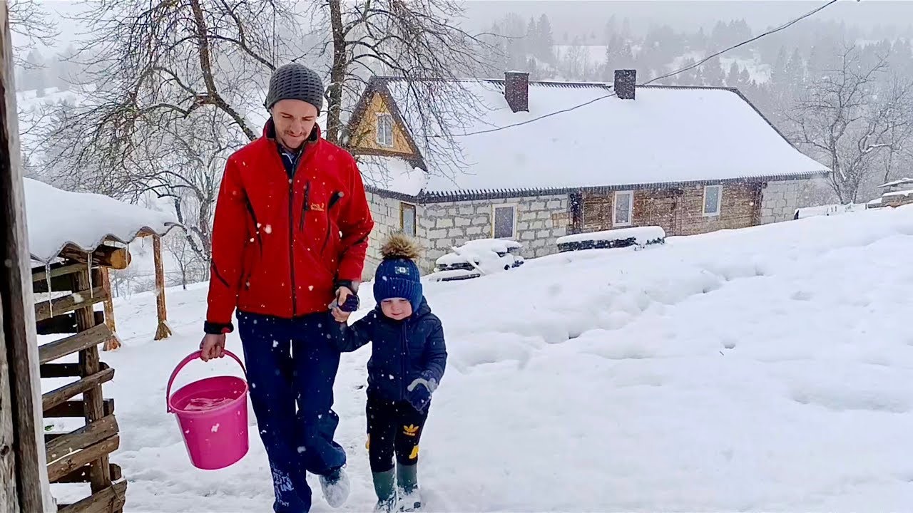 Rural life of a young family in winter on the top of the mountain, at the edge of the world