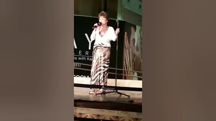 Connie Aquino singing at Kaahumanu Center