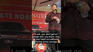 Fan asks if Jensen wants a drink and he delivers the line: 'You don't get on stage and sing your