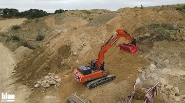 Large Allu Screening Bucket screening overburden in quarry