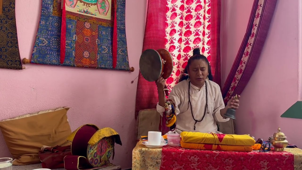 Lama Norbu Rinzin is playing  Chöd damaru drum and kangling, thigh-bone trumpet