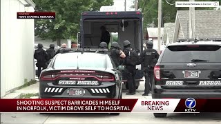 Police in standoff with alleged shooting suspect in Norfolk