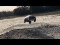 WPL C24 tests suspension upgrade by going off jump and drifting in dirt