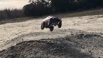 WPL C24 tests suspension upgrade by going off jump and drifting in dirt