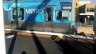 Flinders Street service lead by Comeng 650M departs Frankston