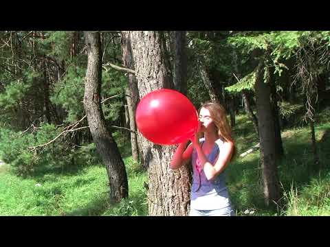 Tania blowing up a balloon