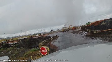 Cat 988 log stacker unloading log truck at the saw mill