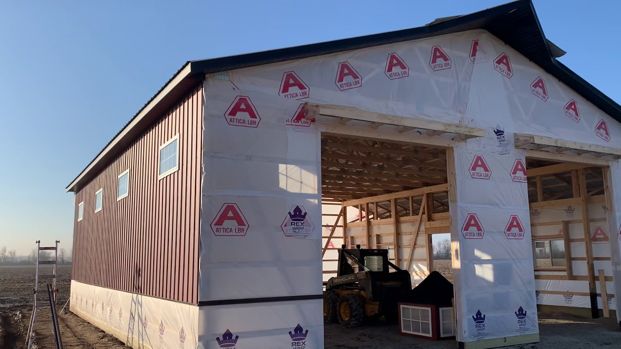 40x48 14’ pole barn with a widow’s peak, textured sidewall metal, green ...