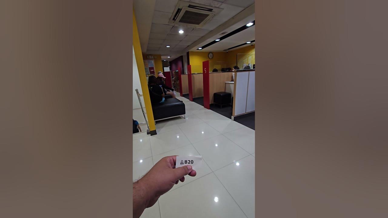 IN FILIPINO BANK WAITING TO EXCHANGE MONEY INTO PESOS SHORTS THE in-filipino-bank-waiting-to-exchange-money-into-pesos-shorts-the