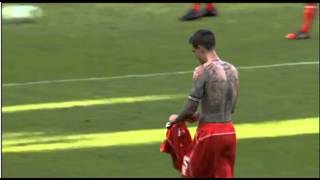 Daniel Agger throws his shirt into the Brondby crowd at half time 16/07/14
