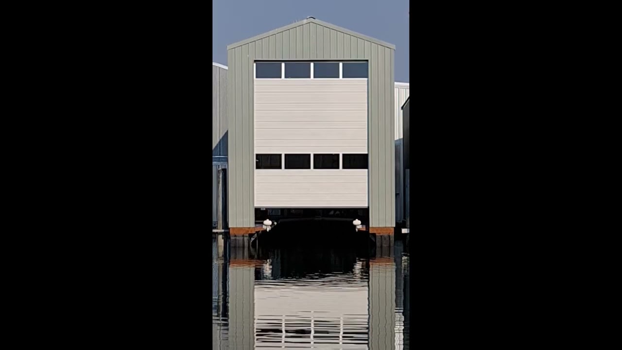 Overhead Door 424 16x18 with RSX on a boathouse