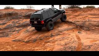 Exercising the rear E-locker. Entrance to Chutes and Ladders trail at Sand Hollow, Utah. 98 ZJ 4.0