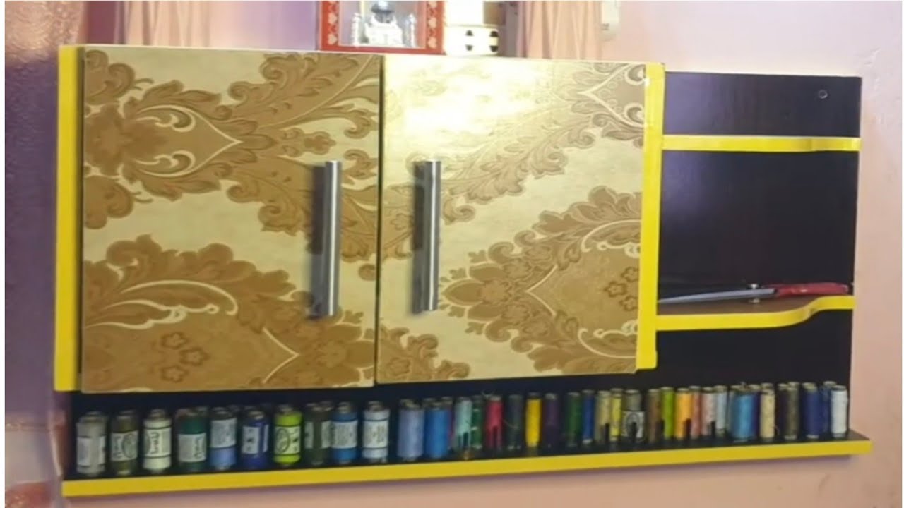 Wall mounted cabinet with thread storage.