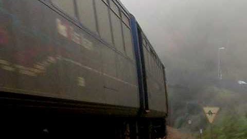 FGW class 153 and 143 come out of the tunnel and into the fog at Dawlish