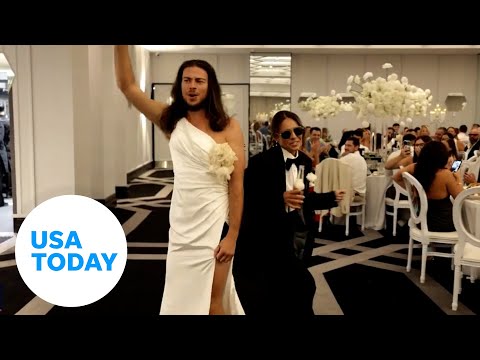 Wedding party shocks guests with surprise outfit swap at reception | USA TODAY