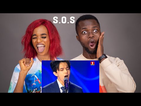 OUR FIRST TIME HEARING Dimash Kudaibergen — S.O.S song at Slavic Bazaar REACTION!!!😱