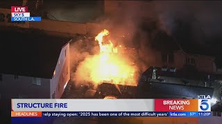 Crews battle structure fire in South L.A. neighborhood
