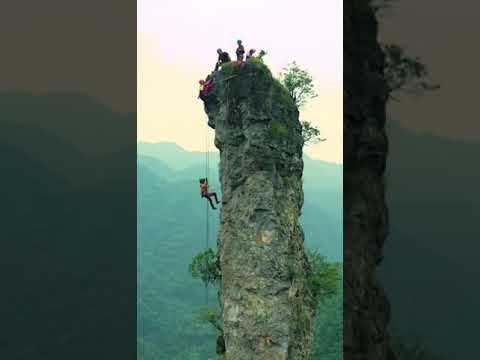 People climb 🧗‍♂️ up Monster Python Peak 🗻 at Shangrao Jiangxi in Sanging Mountain.