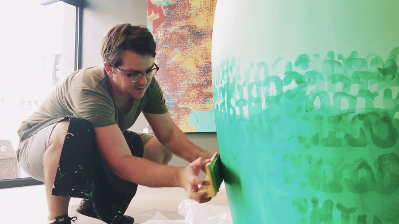 Artist Claude Chandler paints a Matryoshka for 