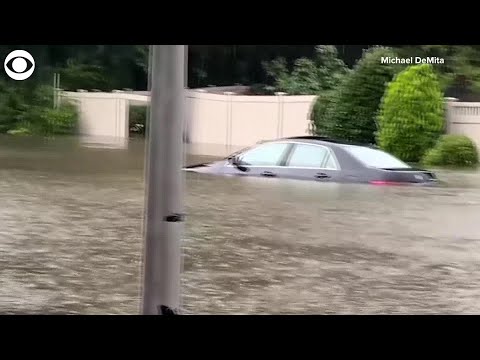 WEB EXTRA: Tropical Storm Elsa Leaves New York Street Flooded, Cars Submerged