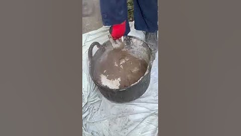 Hot lime mortar mixing. Slaking kibble in aggregates for create traditional building mortars.