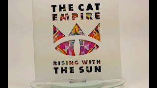 Schlauchalbum mit Ausstanzung - The Cat Empire - Rising With The Sun [Pallas Group]