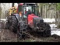 Valtra  forestry tractor logging in wet winter forest