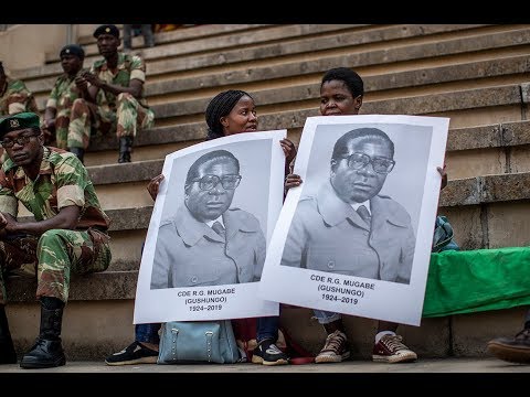 Video: Robert Mugabe nettoværdi: Wiki, gift, familie, bryllup, løn, søskende