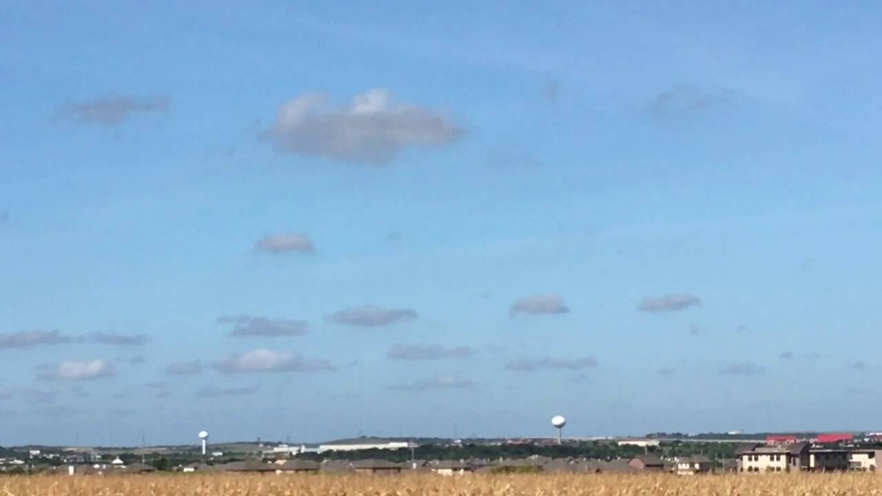 White Disc / UFO Travels in Daytime Sky Over  Manor, Texas