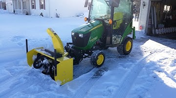 John Deere 47 inch snoblower on a 1025R with a Mauser heated cab