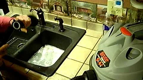 unclogging a drain by Cindy