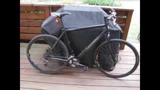 Bike with lights propped up against grill on deck