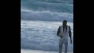 THE BLACK OCEAN EMERGING MERMAN IN A WHITE SUIT