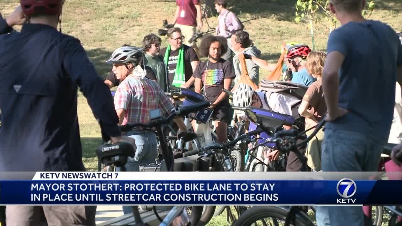 Bicyclists gather to protest removal of downtown bike lane - YouTube