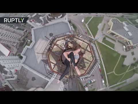 Extreme pole dancer shows skills on the roof of 16-storey building in Russia