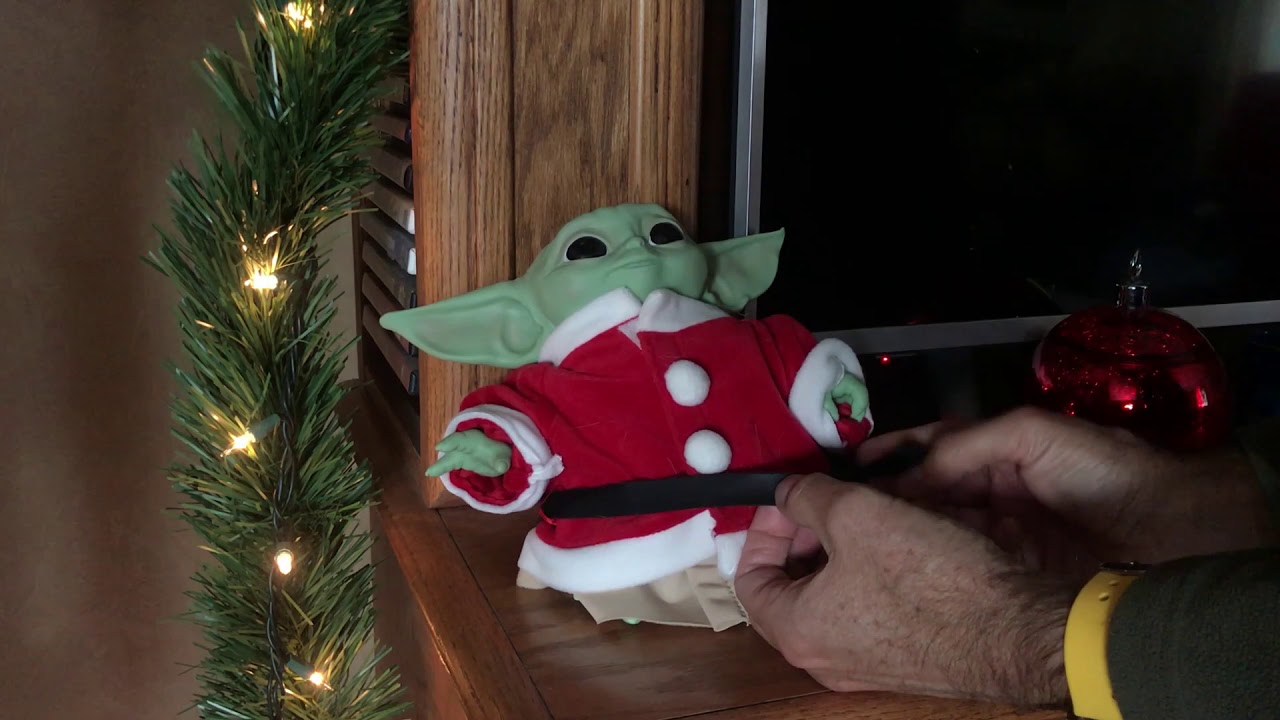 Baby Yoda puts on a Santa Suit - YouTube