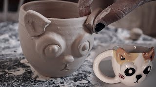 Ceramic mug with cat design
