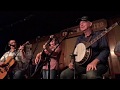 Carl Jackson, Larry Cordle and Val Storey, singing "Is It Too Late Now," at the Station Inn