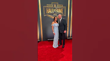 Stephanie McMahon And Triple H Pose On The WWEHOF Red Carpet 