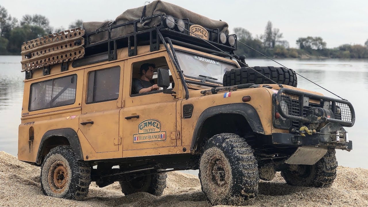 Defender real. Land Rover 110 Camel Trophy. Land Rover Defender трофи. Дефендер d90 Camel Trophy. Дефендер 90 Camel Trophy.