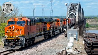 View through the Sibley Railroad Bridge as a westbound mixed freight pokes out through the south end