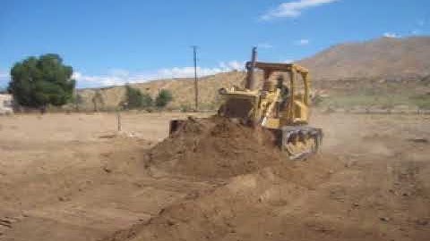 Digging A Trench With A Front Bucket By Operator Delao