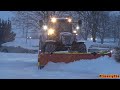 4K| New Holland T7.250 Plowing Snow In A Parking Lot