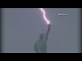 Statue of Liberty struck by lightning during thunderstorm image