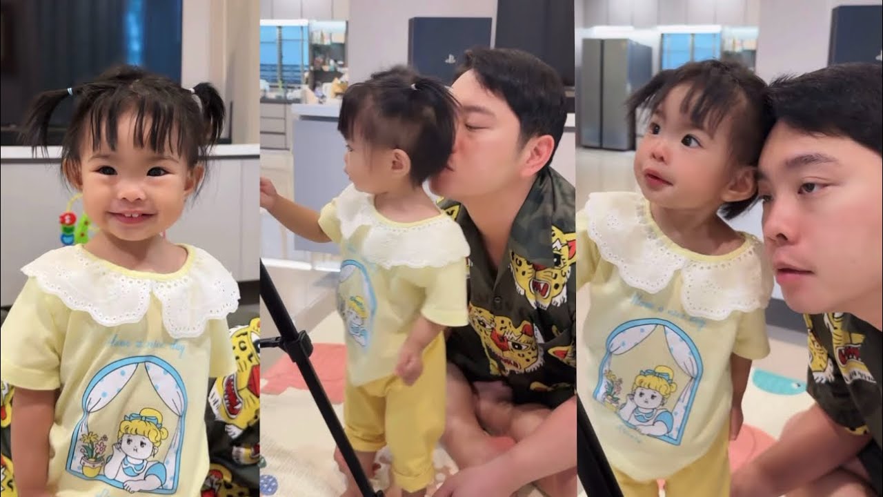 แสนดียืนยิ้มหวาน กำลังเล่าอะไรให้พ่อเอิร์ธแม่เปาฟังน๊า